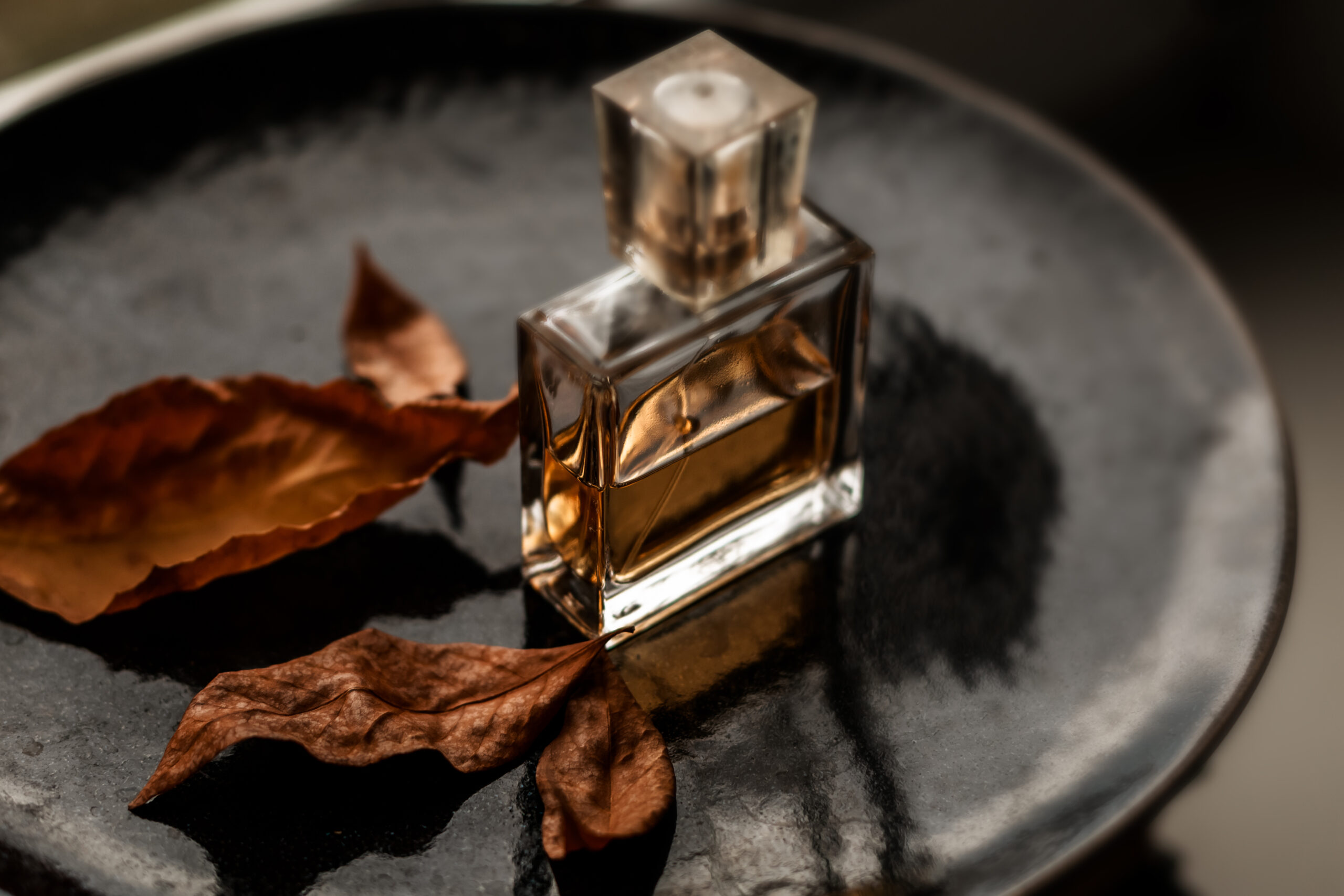Bottle Of Women's Eau De Parfum With Autumn Leaves